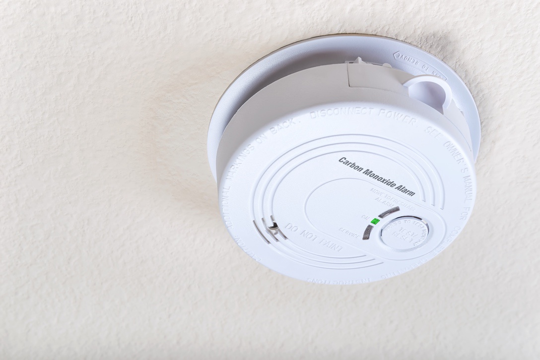 Carbon monoxide detector in home with old furnace to alert residents in case of leak